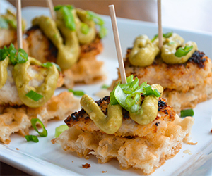 bite size portions of chicken and waffles on a plate