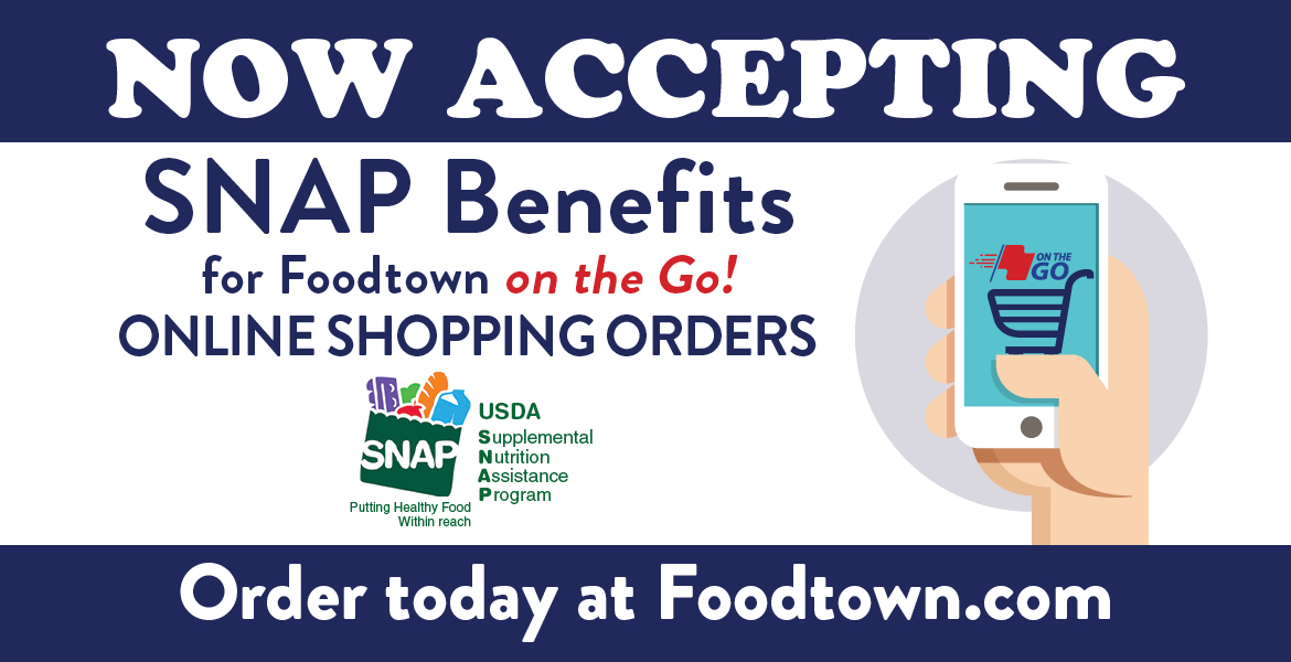 a hand holding up a phone. Text on the image reads now acepting SNAP Benefits for Foodtown on the Go! online shopping orders. Order today at foodtown.com